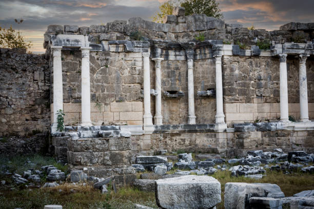The monumental fountain, which is a part of the ancient city of Side, Antalya, Turkey. Selective Focus. No people. Cloud Sunset Sky