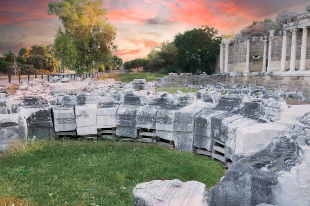 The monumental fountain, which is a part of the ancient city of Side, Antalya, Turkey. Selective Focus. No people. Cloudy Sunset Sky.
