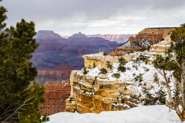 Cliffs of the Grand Canyon covered with snow during winter in Arizona, USA