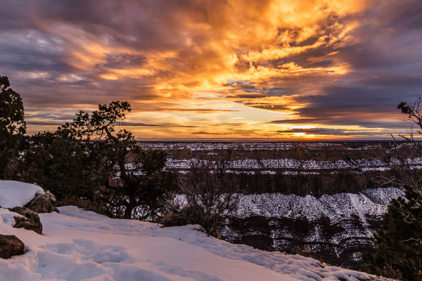 istock Dramatic colored sunset over Grand Canyon on a winter evening 1346730324
