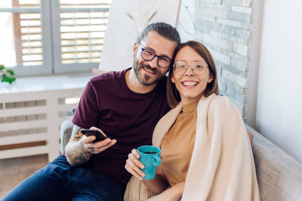 istock Portrait of a couple using smartphone and enjoying 1346732608