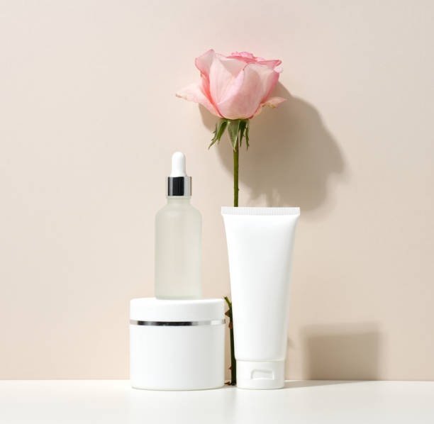 istock empty white plastic tubes and jars for cosmetics. Packaging for cream, gel, serum, advertising and product promotion, mock up 1346732996