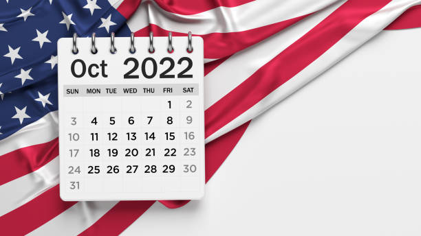 istock White-colored October calendar page and the American flag. 1346733845