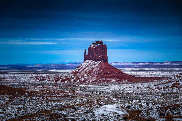 West Mitten Butte of Monument Valley in winter at night West Mitten Butte of Monument Valley in winter at night in USA west mitten stock pictures, royalty-free photos & images
