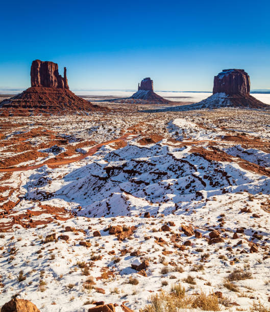 istock Monument valley in winter covered with snow 1346738702
