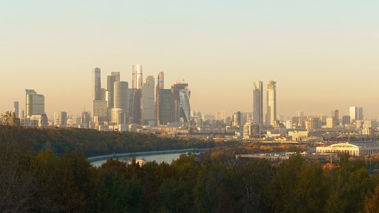 Moscow cityscape during autumn day. Skyscrapers of the modern Moscow International Business center (MIBC). Wide perspective. Moskva river and public park