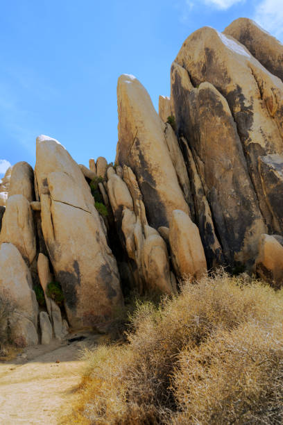 istock Large vertical rock formation in the Mojave Desert 1346738821