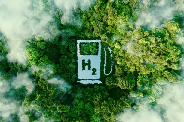 Photo of A lake in the shape of a hydrogen filling station used as a concept to illustrate the environmental friendliness of hydrogen and its potential as the fuel of the future. 3d rendering.