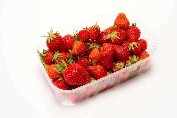 istock Tray of ripe red strawberries on a white background. 1346741584