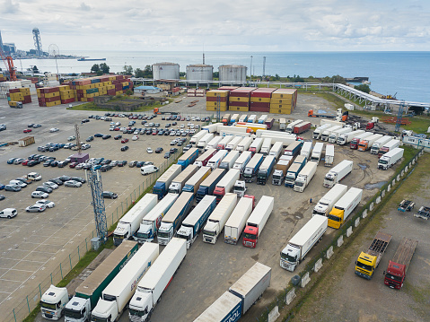 Batumi, Georgia - September 5 2021: Drone view of the parking lot of cars, trucks in the port of Batumi on a summer day