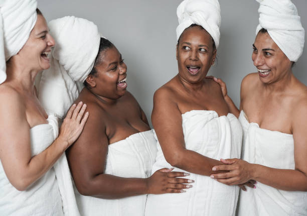 istock Multiracial women having fun doing beauty day together - Multi generational people doing skin care treatment 1346746694