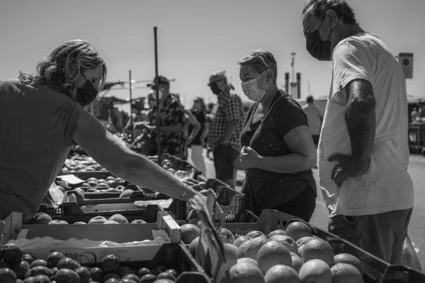 The weekly local vegetables market at Hospitalet de Infant in Costa Dorada, Catalonia, black white stock photo