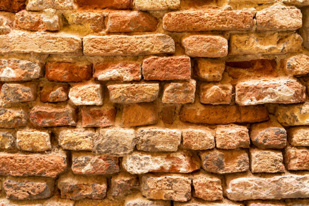 istock Brick wall structure of an old house 1346751839