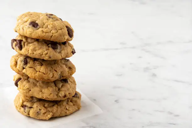 Photo of Stack of Chocolate Chip Cookies on Kitchen Counter with Copy Space