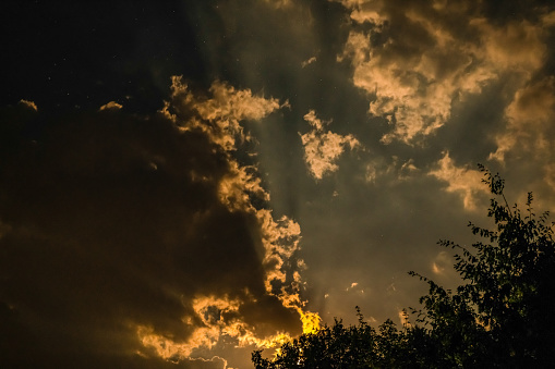 A cloudy, dramatic yellow sky.