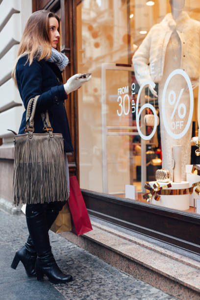 Elegant Woman Looking At Boutique Showcase