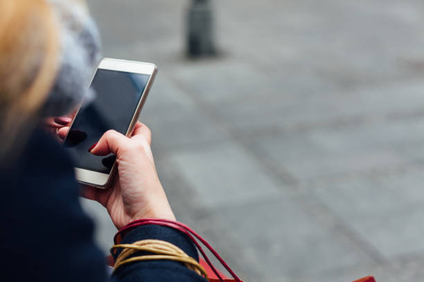 istock Woman Texting On Her Mobile Phone 1346756838