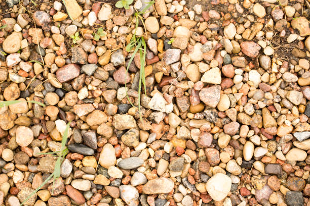 Texture of small pebbles and sand, beautiful small pebbles