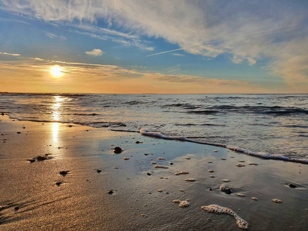 istock Calm Baltic Sea and sandy beach at sunset Close up 1346762135