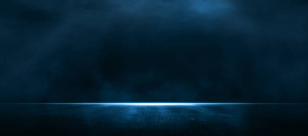 istock Asphalt blue dark street with smoke. Rays, spotlights light . Empty dark scene with neon light. 1346769211