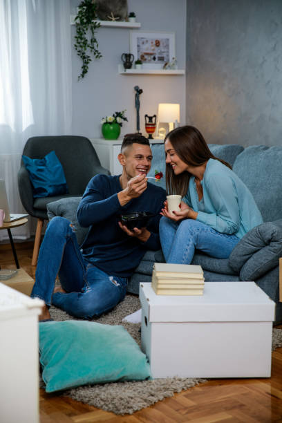istock Having a snack in their new living room 1346771259