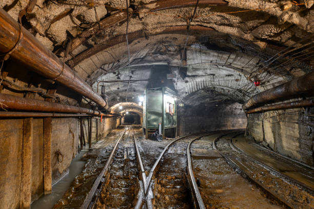 istock Underground mine. Underground railway for transporting ore. Mine trolley as part of an underground freight train 1346772964