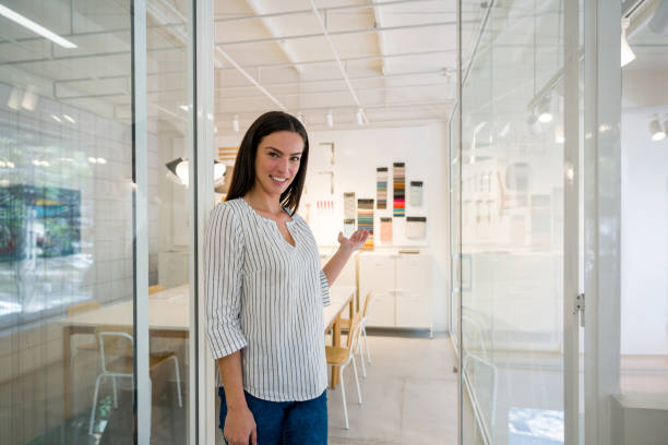 istock Interior designer welcoming customers into her office 1346781651