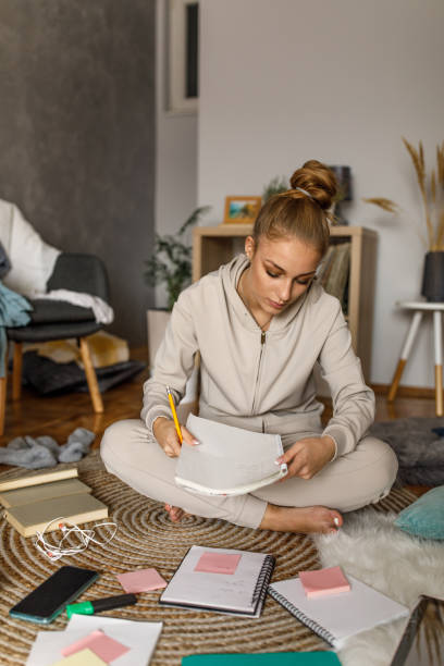 istock Diligent teenager preparing for a test, studying 1346781835