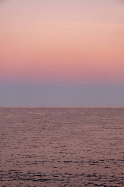 istock Wonderful pinkish and red colored ocean and sky view at dawn 1346784637