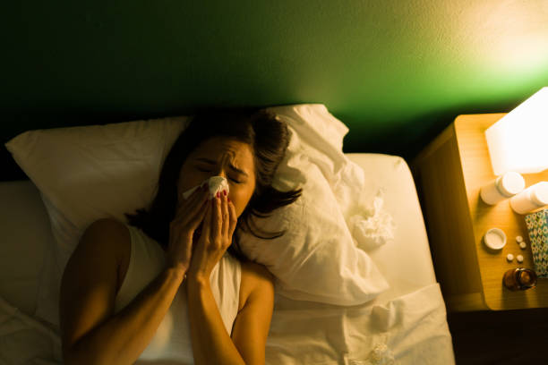 istock Ill young woman suffering from the flu 1346785749