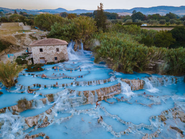 toscane italy, natural spa with waterfalls and hot springs at saturnia thermal baths, grosseto, tuscany, italy aerial view on the natural thermal waterfalls at saturnia - waterfall health spa man made landscape imagens e fotografias de stock