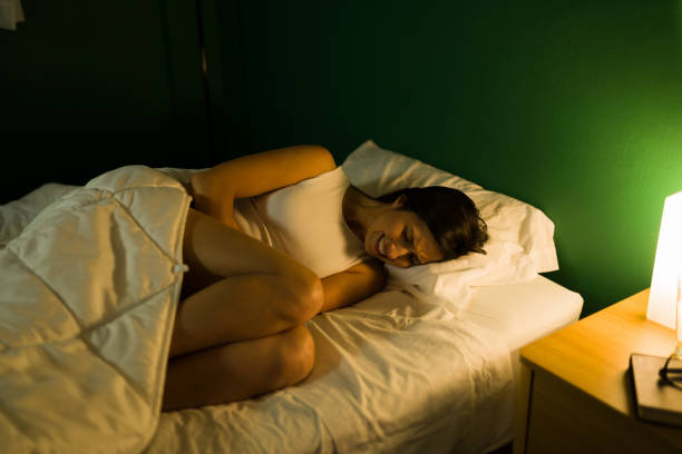 istock Beautiful woman with stomach virus 1346786250