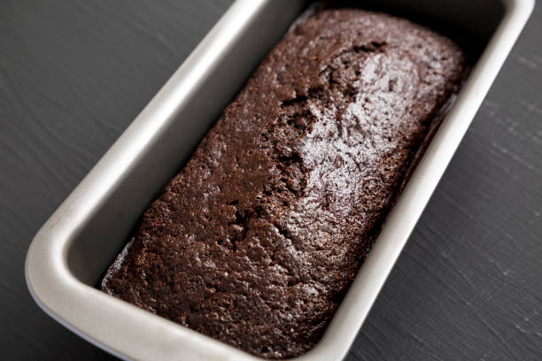 istock Homemade Chocolate Zucchini Bread on a black background, side view. 1346786909