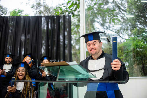 Man with down syndrome on graduation day.