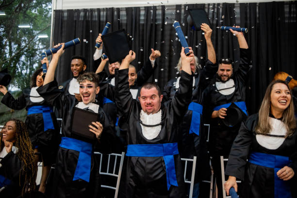 istock Happy graduates celebrating graduation day. 1346787306