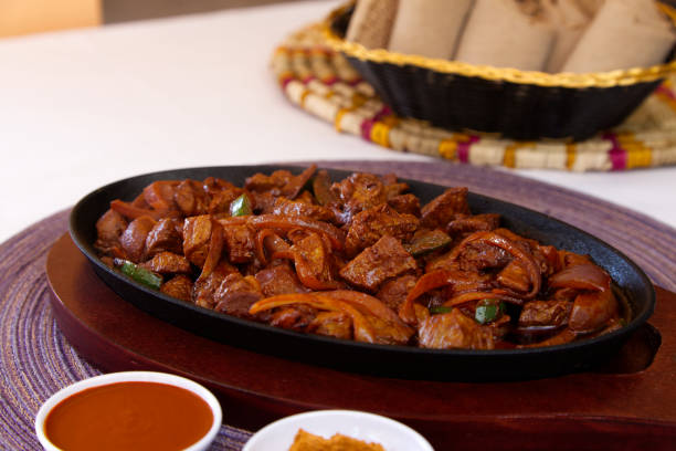 istock Beef Tibs with Injera Bread Close-up 1346789954