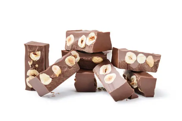 Milk chocolate with hazelnuts, close-up.