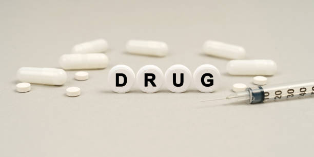 istock On the table are capsules, a syringe and pills that say - 1346791894