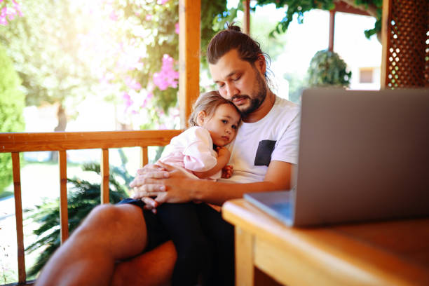 istock Father and daughter using a digital tablet together. 1346794797