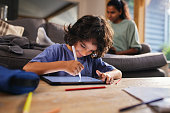 Boy drawing on tablet and smiling