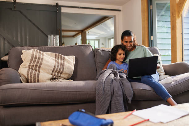 istock Mother and son watching movie on laptop 1346794864