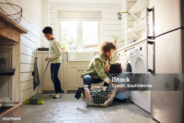 Two Boys Helping Father With Household Chores Stock Photo - Download Image Now - Chores, Housework, Child