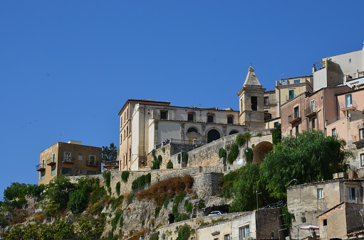 Some panoramic photos of the beautiful city of Ragusa Ibla or ancient Ragusa in Sicily featuring its baroque main cathedral with its classical bell tower with a blue dome.