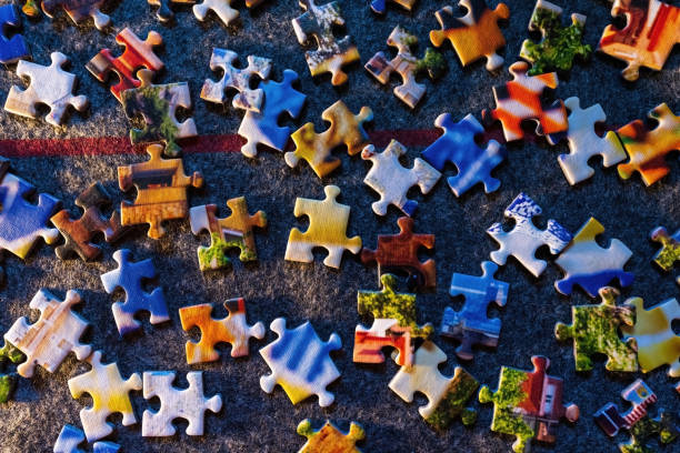 istock Colorful puzzle flat lay separated pieces kept on floor 1346796753