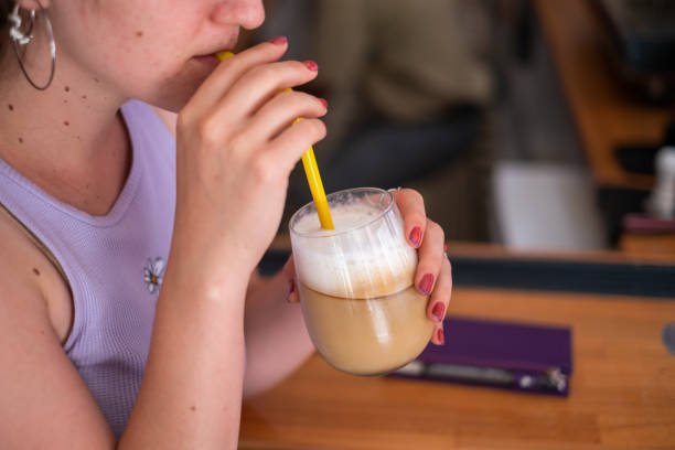 istock Woman Drinking coffee latte 1346797536