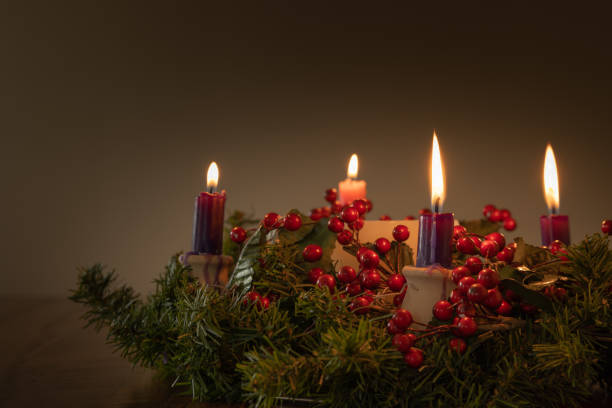 istock Advent wreath with four candles lit 1346799584
