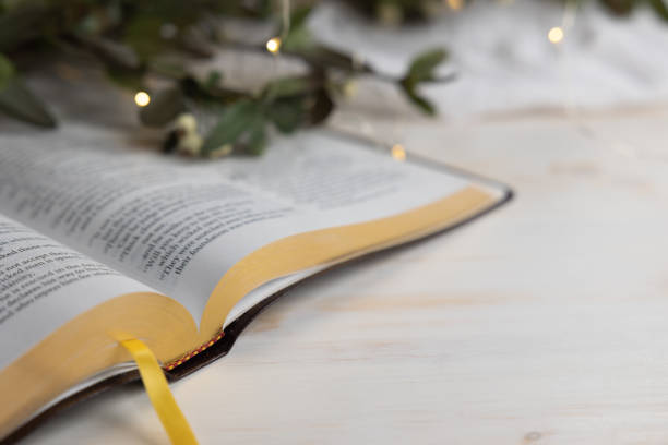 istock Open bible on white with Christmas border 1346799629