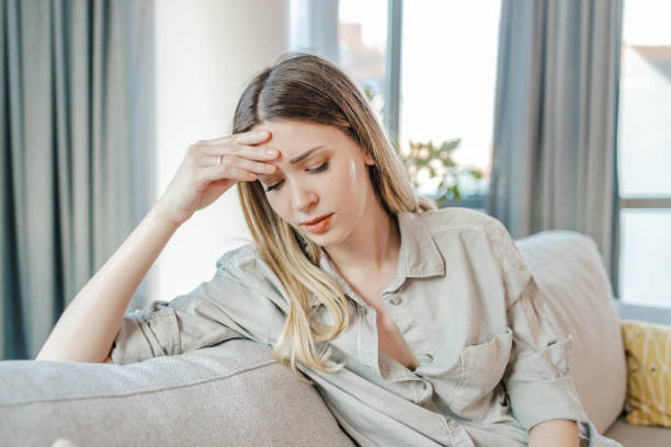 istock Sad young woman at home 1346800866