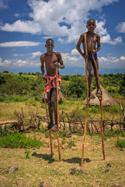 istock Young boys walking on stilts, Ethiopia, Africa 1346800993