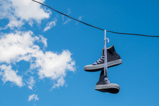 istock Sneakers hanging on electric wires. 1346809005